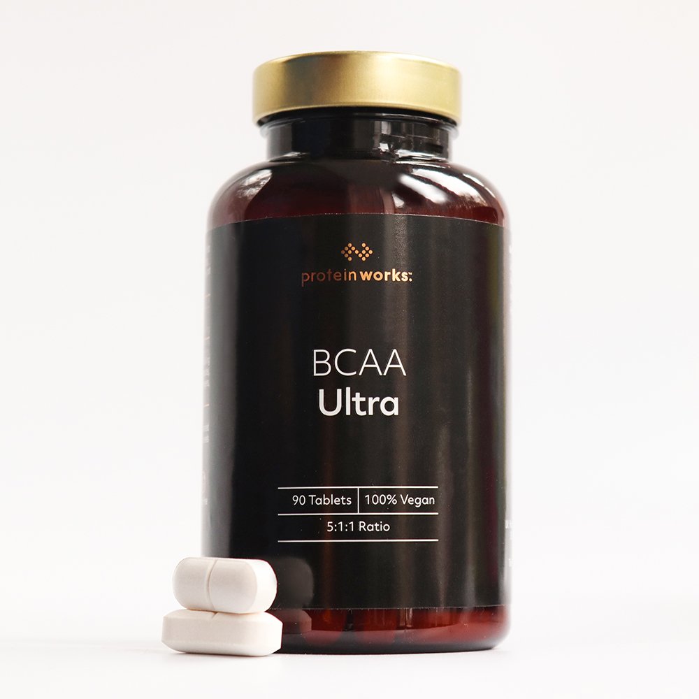 Eine Dose BCAA Ultra mit zwei Tabletten